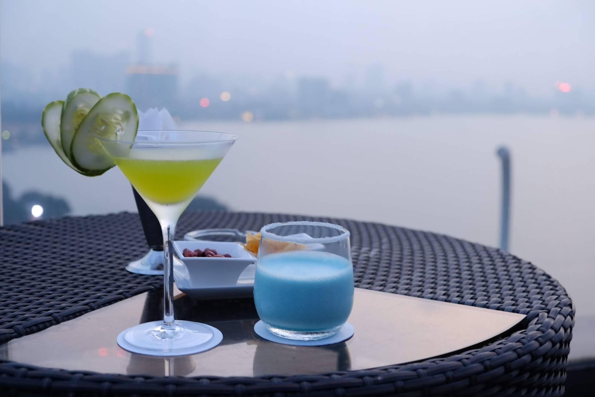 Rooftop bars around West Lake offer panoramic views for sunset
